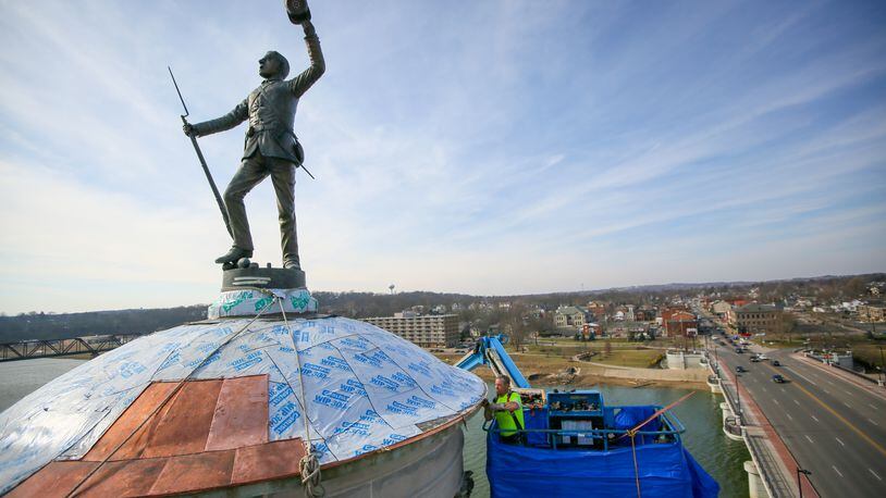 The Soldiers Sailors and Pioneers monument in downtown Hamilton is getting a new copper dome, a contingency not originally contemplated in the restoration project. GREG LYNCH / STAFF