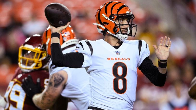 Cincinnati Bengals backup quarterback Brandon Allen (8) was placed on the Reserve/COVID list Monday. He is shown throwing a pass during the first half of the team's preseason NFL football game against the Washington Football Team, Aug. 20, 2021, in Landover, Maryland. (AP Photo/Nick Wass)