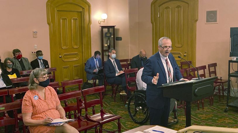 In this Sept. 23, 2021 photo, Tim Young, Ohio's State Public Defender, testifies at the Ohio Statehouse in Columbus in favor of a bill that would abolish capital punishment in Ohio. Young also pushed for a measure that became law earlier this year, and which prohibits inmates from being executed if they suffered from a serious mental illness at the time of their crime, including schizophrenia, or bipolar disorder. (AP Photo/Andrew Welsh-Huggins)