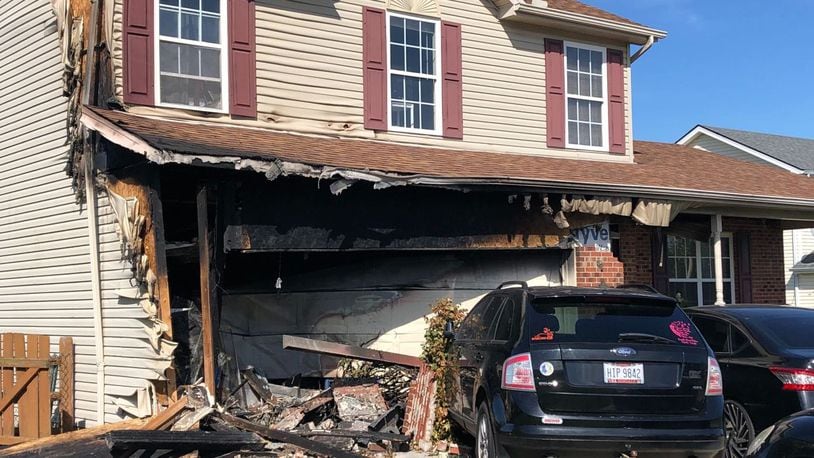 The driver of a van that crashed into a house and caught on fire is dead after they were unable to get out of the vehicle when it engulfed in flames on Sunday. LOT TAN/WCPO-TV