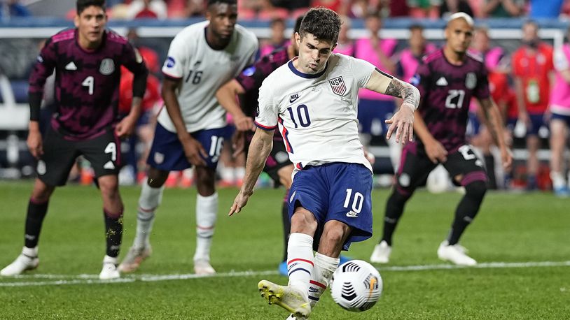 United States' Christian Pulisic (10) kicks a penalty kick for a goal against Mexico during extra time in the CONCACAF Nations League championship soccer match, Sunday, June 6, 2021, in Denver. (AP Photo/Jack Dempsey)