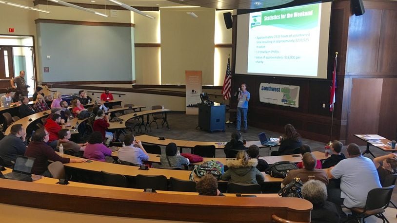 Organizers of the annual Southwest Ohio Give Camp present their finished projects volunteer tech professionals completed to help area non-profits. The weekend-long seminar was held at Miami University’s Voice of America campus.
