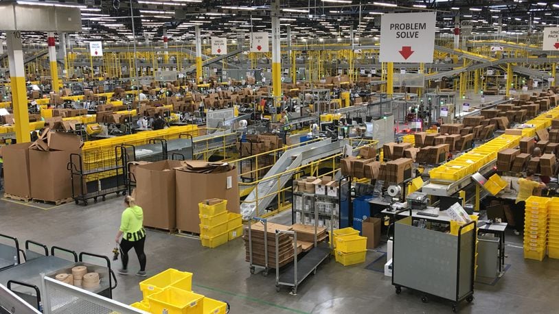 A look inside the Amazon fulfillment center in Etna. The online giant is looking to hire thousands of workers in Ohio this holiday season. KARA DRISCOLL/STAFF