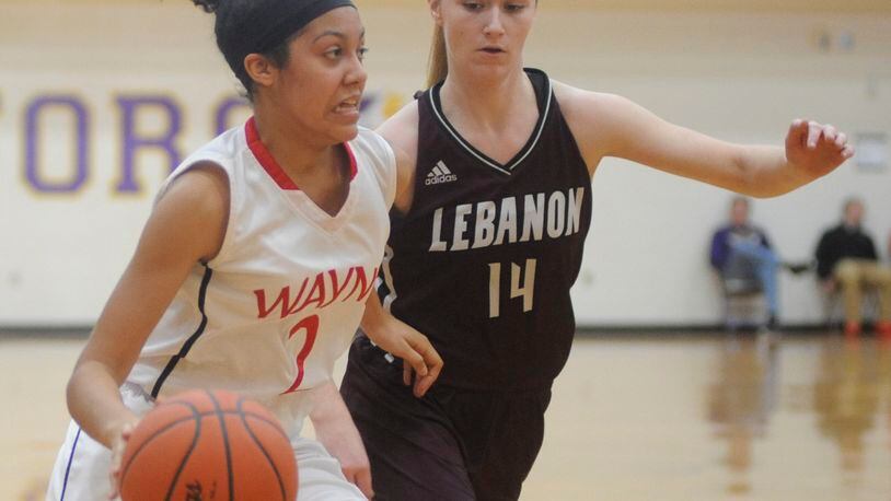 Wayne's Olivia Trice (left) is guarded by Rachael Sweetman. Wayne defeated Lebanon 48-47 in overtime in a girls high school basketball D-I sectional final at Vandalia-Butler on Saturday, Feb. 20, 2016. MARC PENDLETON / STAFF