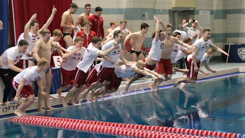 The Miami University men’s swimming team celebrates its first Mid-American Conference championship in 13 years. PHOTO COURTESY OF MIAMI ATHLETICS