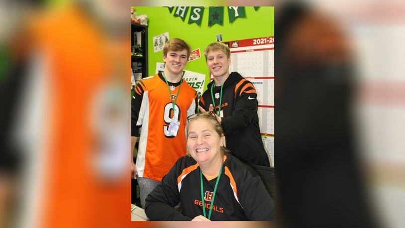 It will be the first Super Bowl for the Cincinnati Bengals in more than three decades but the day after will be a normal school day for most area schools, though some are giving their students and staffers the day off. Badin High School in Hamilton will be among those locally not holding classes. The school has been in a spirited, pro-Bengal mood with staffers and students sporting their Bengals' gear. Pictured are seniors Jack Walsh (left) and classmate Jackson Niesen in the Office of Campus Ministry with Director of Campus Ministry Gina Helms seated. CONTRIBUTED