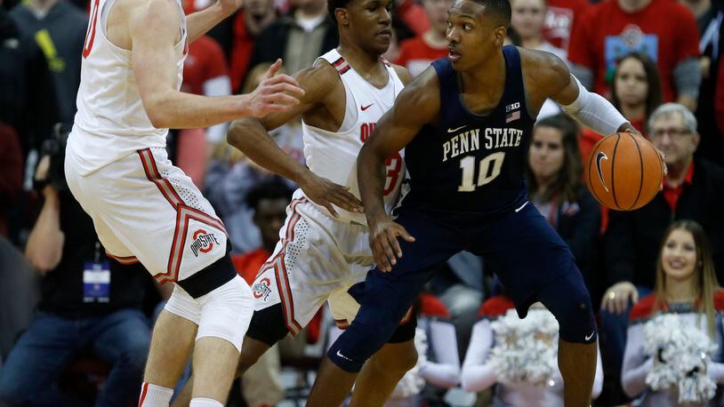 Penn State guard Tony Carr, right, works against Ohio State guard C.J. Jackson, center, and center Micah Potter during an NCAA college basketball game in Columbus, Ohio, Thursday, Jan. 25, 2018. Penn State won 82-79. (AP Photo/Paul Vernon)