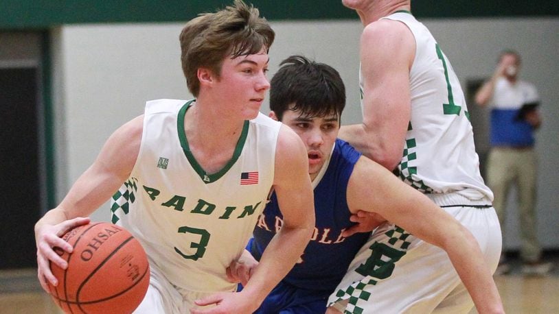 Josh Hegemann of Badin (with ball) uses a screen from teammate Spencer Giesting (right) to get past Sam Severt of Carroll. Badin defeated visiting Carroll 65-52 in a GCL Co-Ed boys high school basketball game on Friday, Dec. 20, 2019. MARC PENDLETON / STAFF