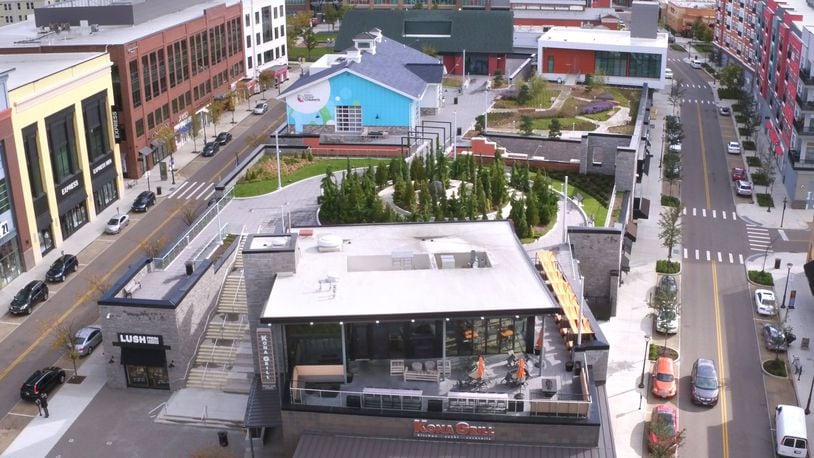 This rooftop garden at Liberty Center has a spiral walkway, Sabin Hall, TriHealth Triumph gardens and Unity Chapel and Kona Grill near The Square. TY GREENLEES / STAFF