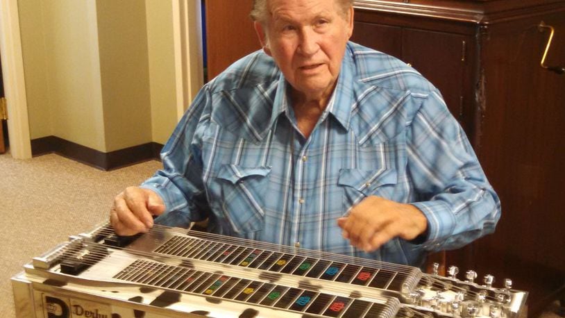 Ray "Chubby" Howard demonstrates his craft on his custom pedal steel guitar that was given to him by country music stars Brooks and Dunn. Howard, of Franklin, died Dec. 23. He was 95. FILE PHOTO