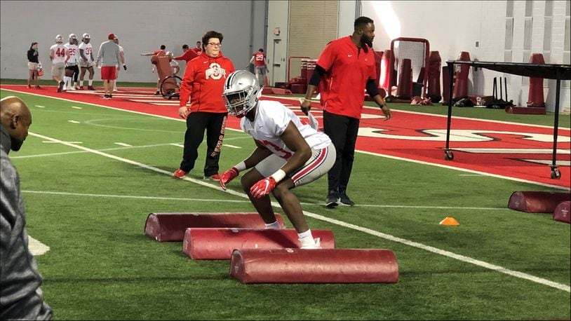 Ohio State true freshman Zach Harrison works out on the first day of spring football in Columbus.