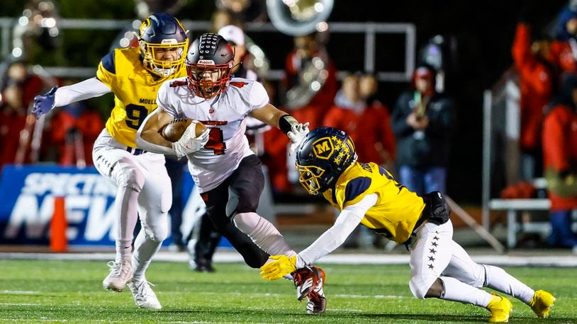 Lakota West running back Trent Lloyd carries the ball during their Division I Regional final football playoff game against Moeller Friday, Nov. 19, 2021 at Dwire Field in Mason. Moeller won 21-17. NICK GRAHAM / STAFF