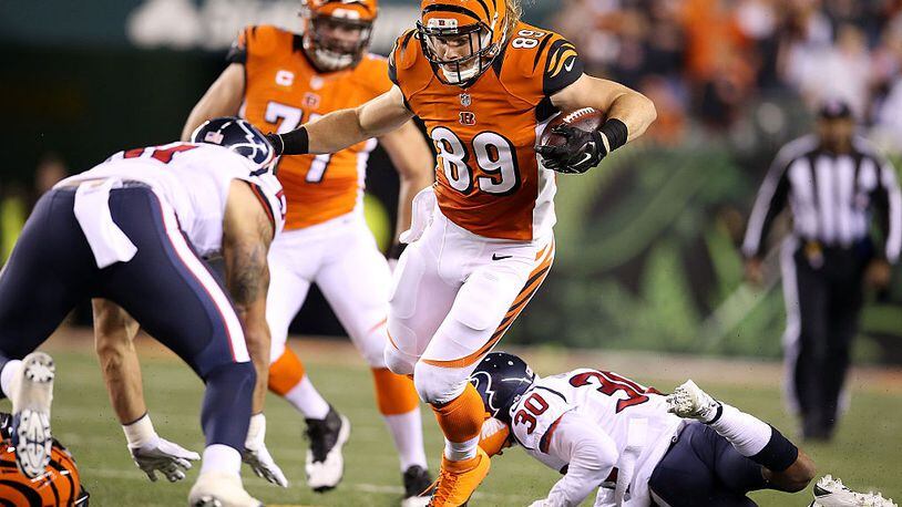 CINCINNATI, OH - NOVEMBER 16: Ryan Hewitt #89 of the Cincinnati Bengals is tripped up by Kevin Johnson #30 of the Houston Texans during the second quarter at Paul Brown Stadium on November 16, 2015 in Cincinnati, Ohio. (Photo by Andy Lyons/Getty Images)
