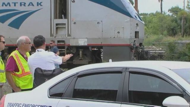 Amtrak train hits car on track
