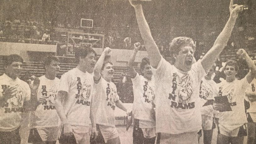 Badin’s Jon Webster (front) celebrates with his teammates after the Rams defeated Zoarville Tuscarawas Valley 68-63 to win the Division III state championship March 26, 1988, at St. John Arena in Columbus. COX MEDIA FILE PHOTO