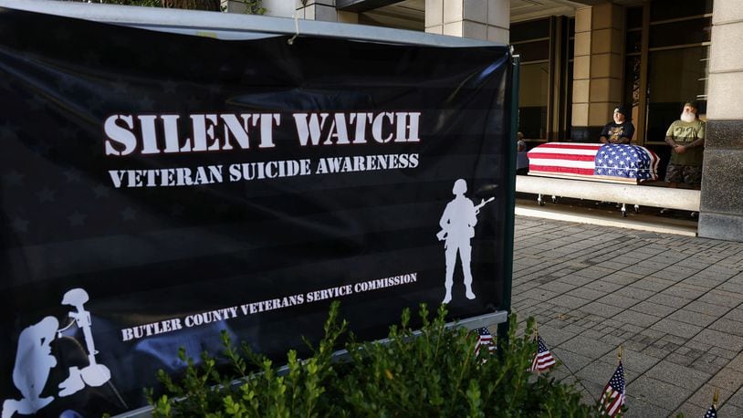 Volunteers stand watch over a flag draped casket as the Butler County Veterans Service Commission and volunteers held a Silent Watch for veteran suicide awareness Wednesday, Sept. 21, 2022 outside the Veterans Service Commission office on High Street in Hamilton. NICK GRAHAM / STAFF
