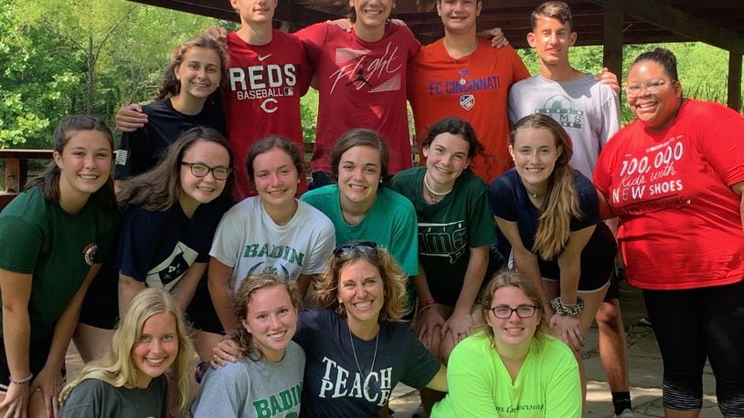 Megan Halverson, Christian service coordinator at Badin High School, is pictured with Badin students who performed community service last year at Solsberry Hill in Indiana. Four service trips planned this summer may be in jeopardy because of the coronavirus. SUBMITTED PHOTO