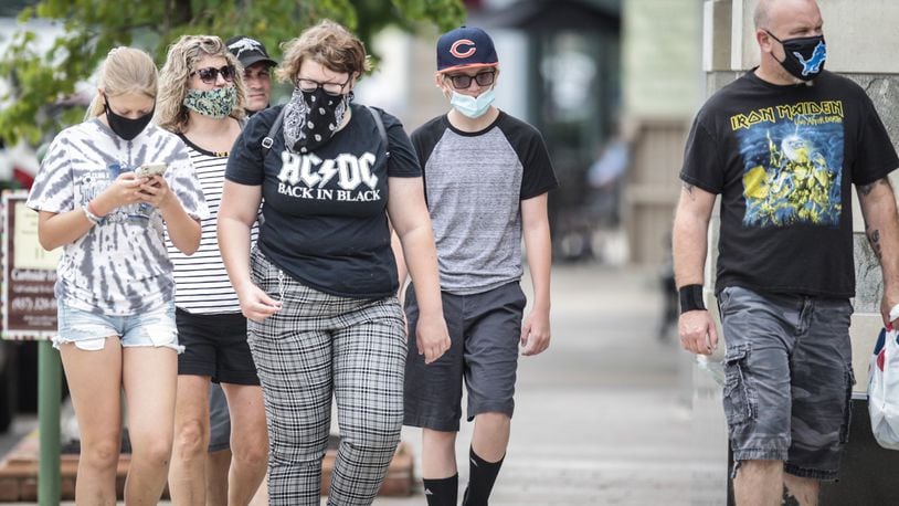 Most shoppers at The Greene in Greene County were either carrying masks or wearing mask Thursday afternoon July 23, 2020. Thursday at 6p.m. Gov. Mike Dewine issued a mask mandate for all of Ohio. JIM NOELKER/STAFF