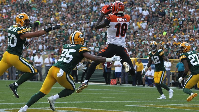 GREEN BAY, WI - SEPTEMBER 24: A.J. Green #18 of the Cincinnati Bengals catches a touchdown pass during the first quarter against the Green Bay Packers at Lambeau Field on September 24, 2017 in Green Bay, Wisconsin. (Photo by Dylan Buell/Getty Images)