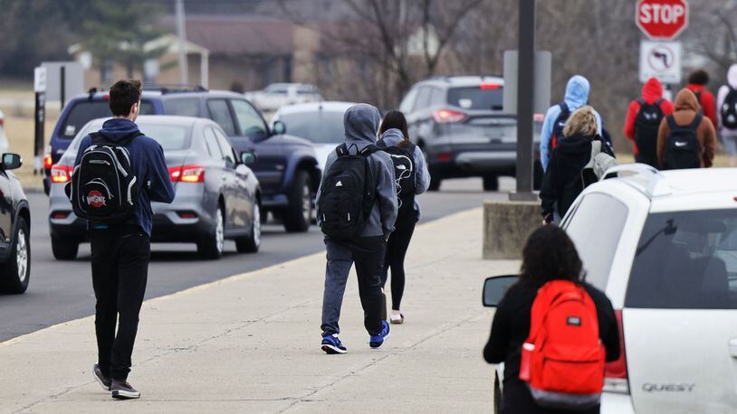 Students leave Lakota East High School at the end of the school day. NICK GRAHAM/STAFF