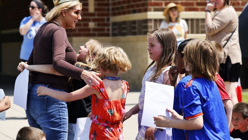 Ridgeway Elementary School principal Kathy Wagonfield was honored by teachers and hundreds of students Thursday, May 2, 2024 in Hamilton. She was surprised during a secret assembly to celebrate her. A tree was planted in her honor in front of the school. NICK GRAHAM/STAFF