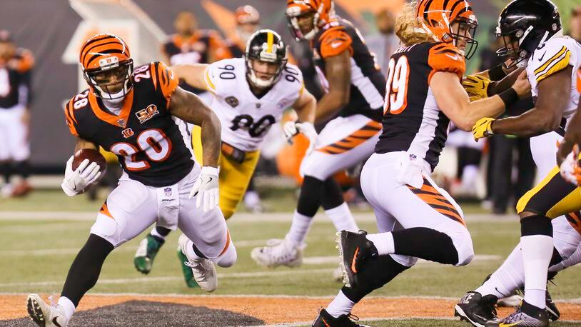 Bengals running back Joe Mixon (28) looks for yards during the first quarter of their game against the Steelers, at Paul Brown Stadium, Monday, Dec. 4, 2017. GREG LYNCH / STAFF