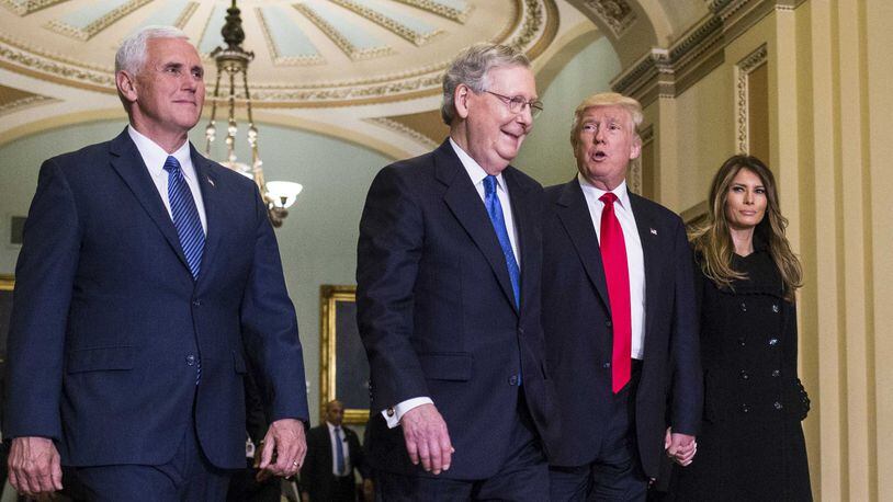 President-elect Donald Trump and running mate Mike Pence (left) met with Senate Majority Leader Mitch McConnell, R-Ky., on Capitol Hill last week. McConnell has said scrapping most of the Obamacare law is “pretty high on our agenda.” (Al Drago/The New York Times)