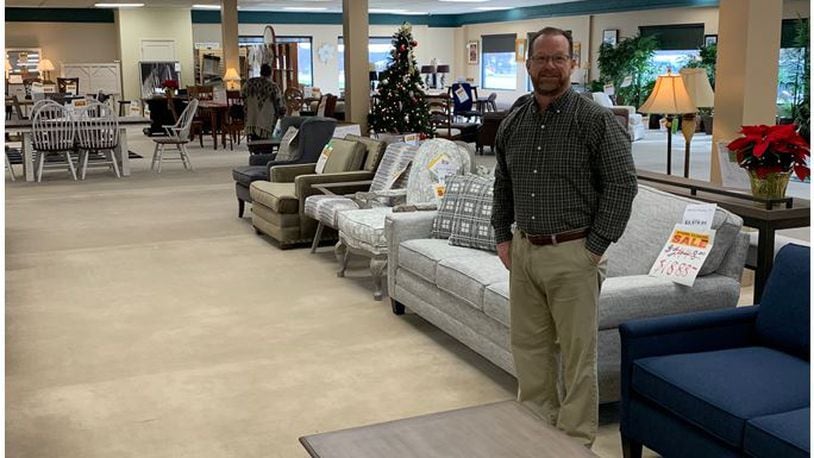 David Edwards, president of Edwards Furniture in Springboro, stands in the store's showroom Monday as the third-generation business conducts its store closing sale. The store has been in business since 1945. ED RICHTER/STAFF