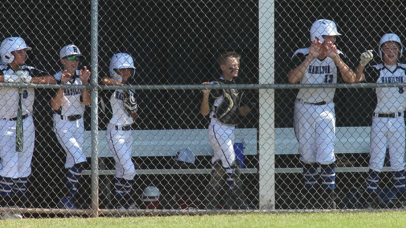 West Side players watch from the dugout during the 2019 Little League state tournament in New Albany. David Jablonski/Staff