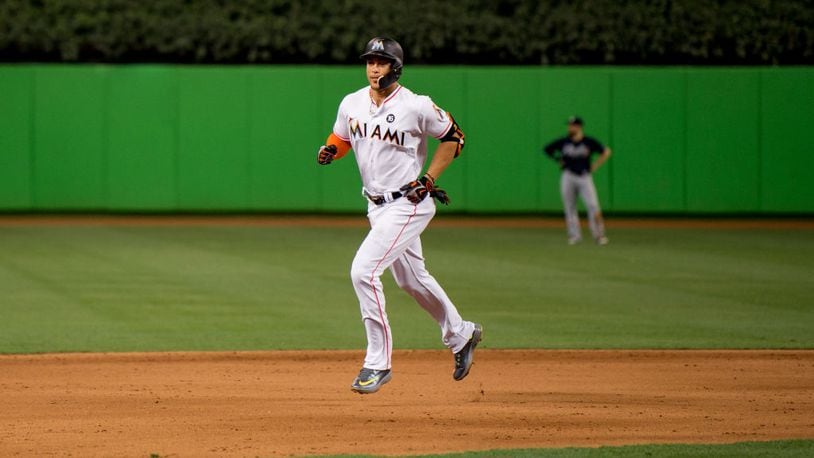 Miami's Giancarlo Stanton circles the bases after hitting his 59th home run of the season in the eighth inning of Thursday night's game in Miami.