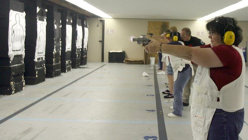 Despite often having a police presence at meetings, some Butler County elected officials say they would be in favor of a law that permits CCW holders to carry in government buildings. STAFF FILE PHOTO