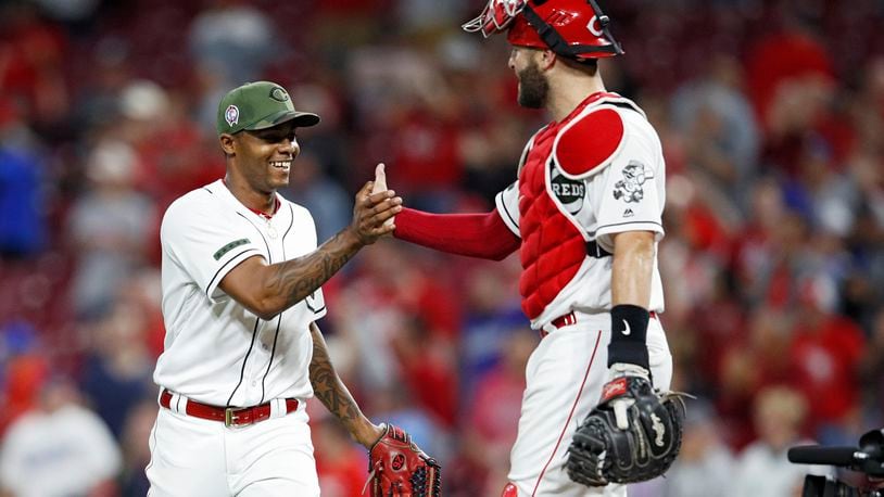 CINCINNATI, OH - SEPTEMBER 11: Raisel Iglesias #26 and Curt Casali #38 of the Cincinnati Reds celebrate after the final out in the ninth inning of the game against the Los Angeles Dodgers at Great American Ball Park on September 11, 2018 in Cincinnati, Ohio. The Reds won 3-1. (Photo by Joe Robbins/Getty Images)