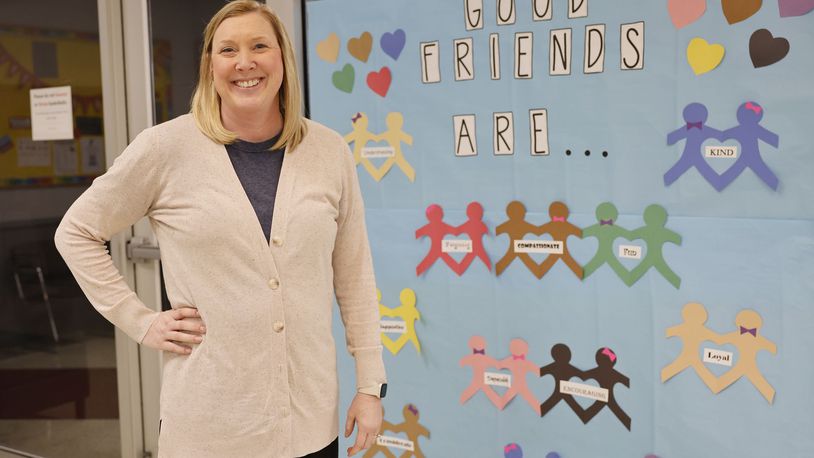 Fairfield North Elementary School Counselor Laura Monnier was and remains on the front lines of the emotional health battle pre and post-pandemic. Monnier is seen here in front of one of the many social-emotional development posters featured in the Fairfield Twp. school. NICK GRAHAM/STAFF