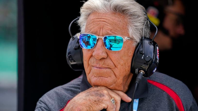 FILE - 1969 Indy 500 champion Mario Andretti watches from his grandson Marco Andretti's pit area during practice for the Indianapolis 500 auto race at Indianapolis Motor Speedway in Indianapolis, May 19, 2023. Mario said Friday, April 19, 2024, he was "offended" by the reasons given by Formula One for denying his family the chance to join the global motorsports series. (AP Photo/Michael Conroy, File)