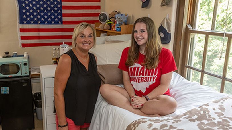 Laura Everett Bowling, left, and her daughter Sarah Bowling, shown on move-in day Thursday, Aug. 24, 2023, were assigned the same Emerson Hall room 33 years apart at Miami University. SCOTT KISSELL/CONTRIBUTED