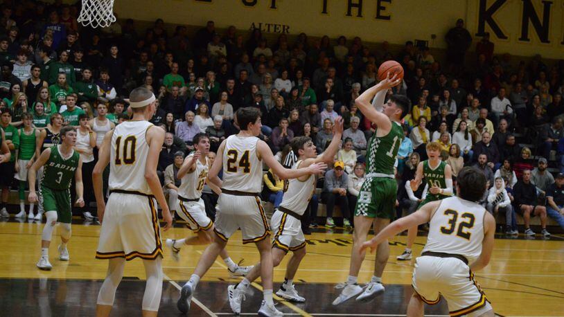 Badin’s Spencer Giesting puts up a shot in the lane surrounded by Alter players during Friday night’s game. The Knights won 45-42. Eric Frantz/CONTRIBUTED