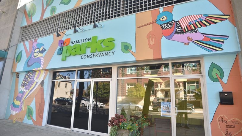 A nature-themed mural marks the entrance of the Hamilton Parks Conservancy office in downtown. Murals depicting birds native to Ohio will be painted in six Hamilton parks this summer. CONTRIBUTED