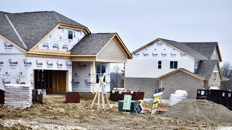 Houses are under construction by M/I Homes in the Arbor Park subdivision in Liberty Township. NICK GRAHAM / STAFF