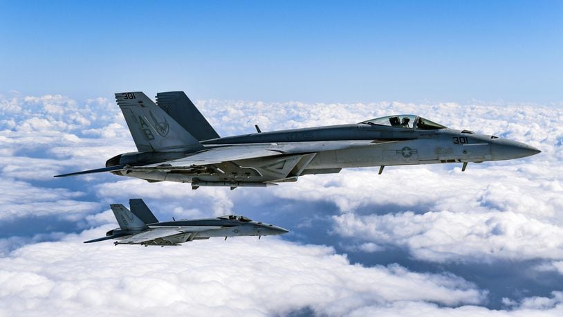 F/A-18E Super Hornets from Strike Fighter Squadron (VFA) 136 “Knighthawks” fly in formation during a photo exercise over Calif. The Knighthawks are an operational U.S. Navy strike fighter squadron based at Naval Air Station Lemoore, Calif. and are attached to Carrier Air Wing (CVW) One. (U.S. Navy photo by Chief Mass Communication Specialist Shannon Renfroe/Released)