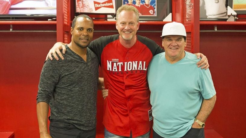Barry Larkin and Pete Rose, two all-time Cincinnati Reds greats, appeared at Sports Gallery in 2016 for a public signing. Sports Gallery is owned by Mark Fugate, middle. The store is temporarily closed and all player signings postponed due to the coronavirus. SUBMITTED PHOTO