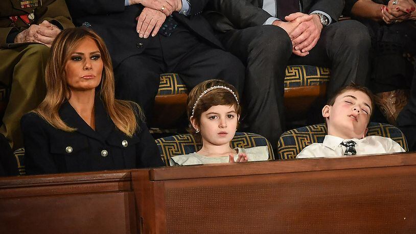 U.S. first lady Melania Trump with Grace Eline and Joshua Trump, special guests of President Donald Trump, look during of the State of the Union address at the US Capitol on February 5, 2019 in Washington, DC. (Photo by MANDEL NGAN/AFP/Getty Images)