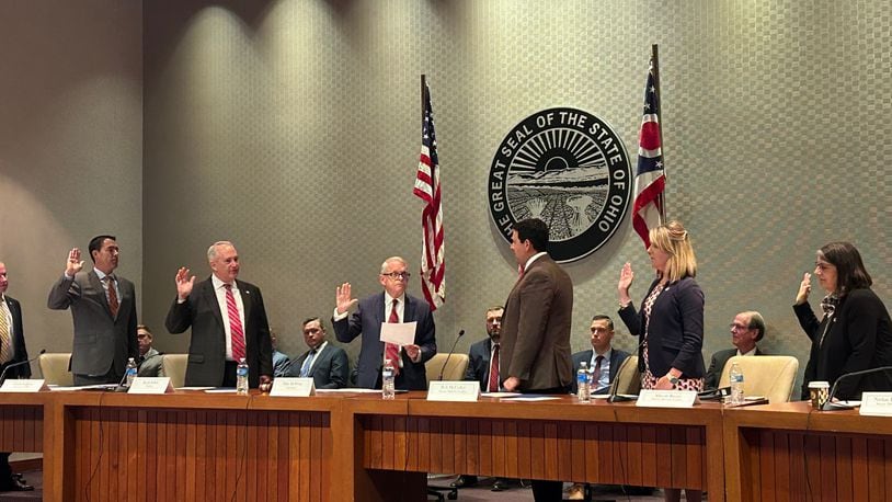 Members of the Ohio Redistricting Commission are sworn in by Gov. Mike DeWine on Sept. 13, 2023.