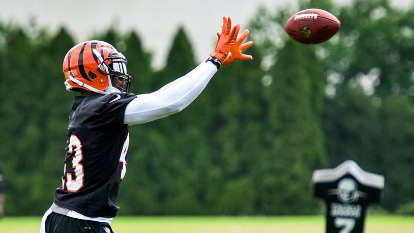 Bengals’ George Iloka catches a pass during organized team activities Tuesday, May 22 at the practice facility near Paul Brown Stadium in Cincinnati. NICK GRAHAM/STAFF