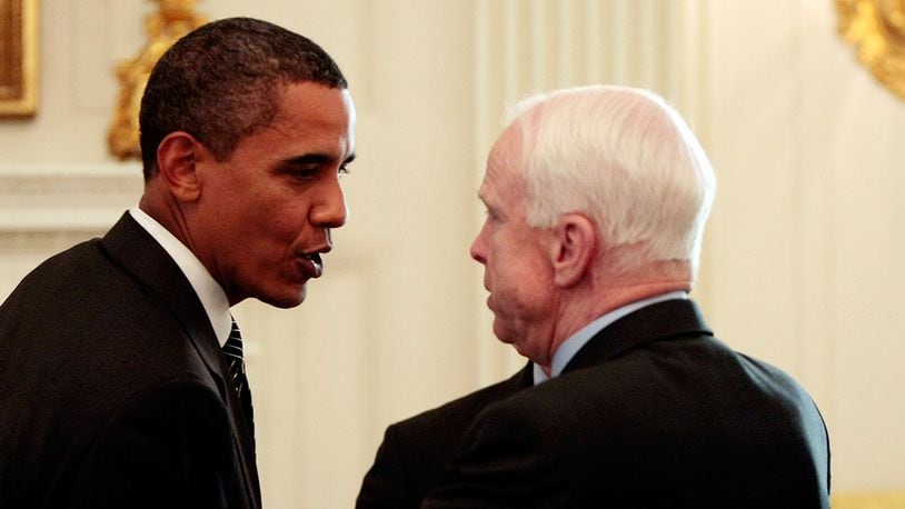 WASHINGTON - JUNE 25:  U.S. President Barack Obama (L) talks with Sen. John McCain (R-AZ) after a meeting with a bipartisan group of Senators and members of Congress in the State Dining Room at the White House June 25, 2009. (Photo by Chip Somodevilla/Getty Images)