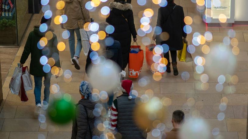 BIRMINGHAM, ENGLAND - DECEMBER 24: Shoppers make their last minute purchases on Christmas Eve on December 24, 2018 in Birmingham, England. Financial management consultancy Deloitte has predicted larger than normal discounts for boxing day sales as retailers aim to recuperate sales after a weak lead up to Chrismas. (Photo by Christopher Furlong/Getty Images)