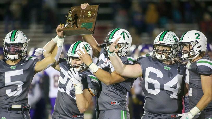 The captains of the Badin High School football team hold the trophy after beating Bellbrook 21-9 in the Division III, Region 12 final on Friday night at Trotwood Madison High School. CONTRIBUTED PHOTO BY MICHAEL COOPER
