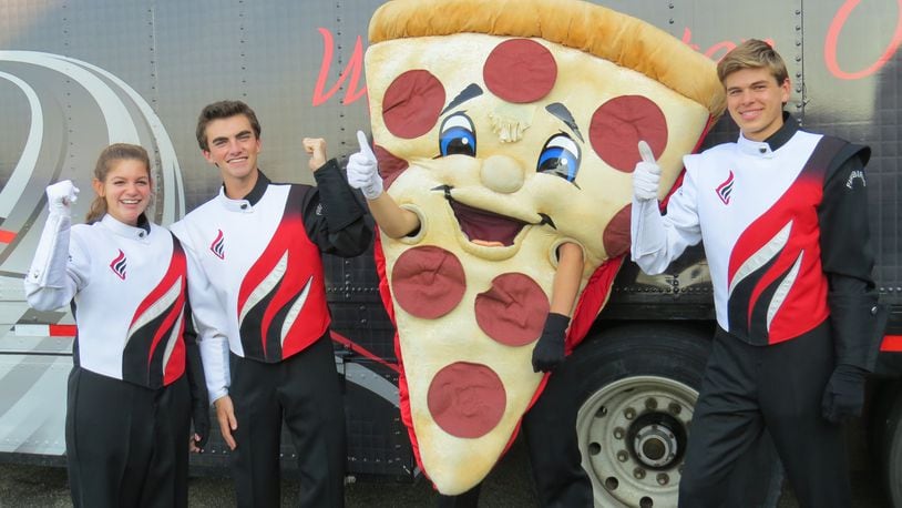 UNO Pizzeria and Grill in West Chester Twp. will once again host a fundraiser for the Lakota West Marching Band, this time to help with the group’s costs for a performance at Disney World’s Magic Kingdom on New Year’s Eve. Pictured are Lakota West Marching Firebird band members Rachel Pizzuco, Nick Linder, Nathan Simon (in the pizza costume), and Christian Bogard. CONTRIBUTED