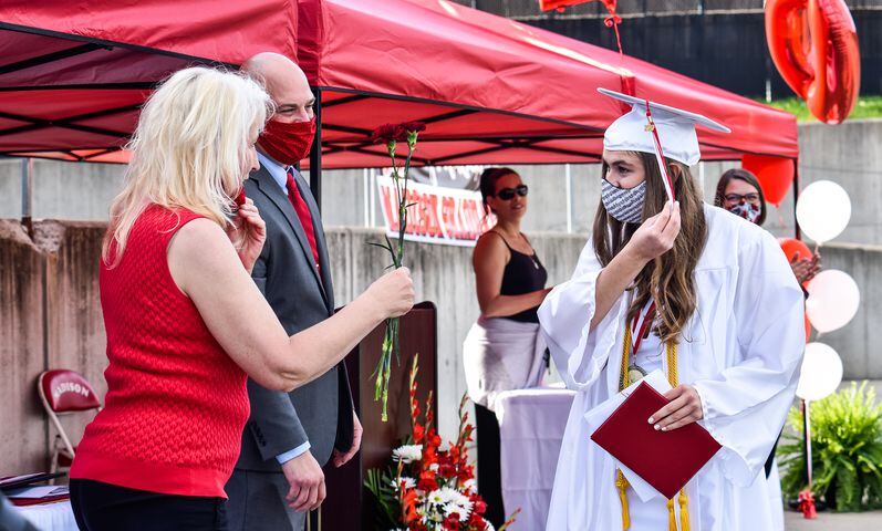 Madison High School drive-thru graduation ceremony at Land of Illusion