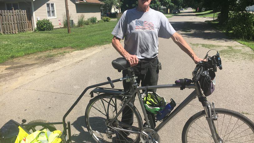 Michael McCracken, 67, of Hamilton, rode his 21-speed bike 450 miles from Butler County to Michigan and back to raise money and awareness about the MDA. RICK McCRABB/STAFF