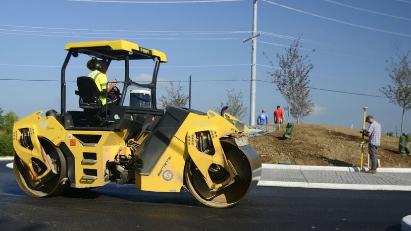 It took nearly three months for the city to complete its first modern roundabout project, a three-pronged traffic circle at Gray and River roads just south of Marsh Park. The driver of an asphalt roller flattens an undercoat of asphalt on Wednesday, Aug. 8, 2019, around the traffic circle. MICHAEL D. PITMAN/STAFF